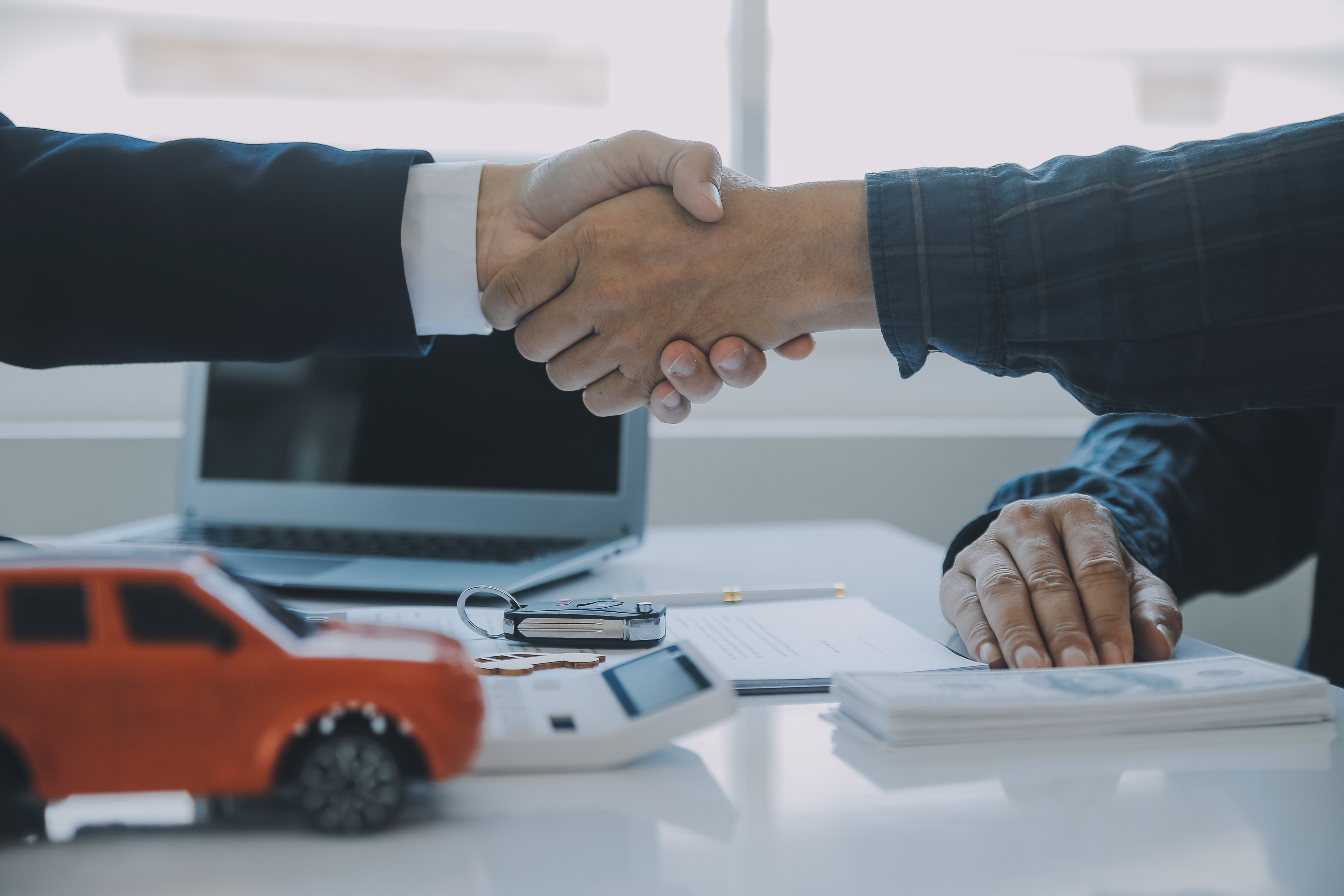 closeup-asian-male-people-car-salesman-sales-manager-offers-sell-car-explains-reads-terms-signing-car-contract-insurance