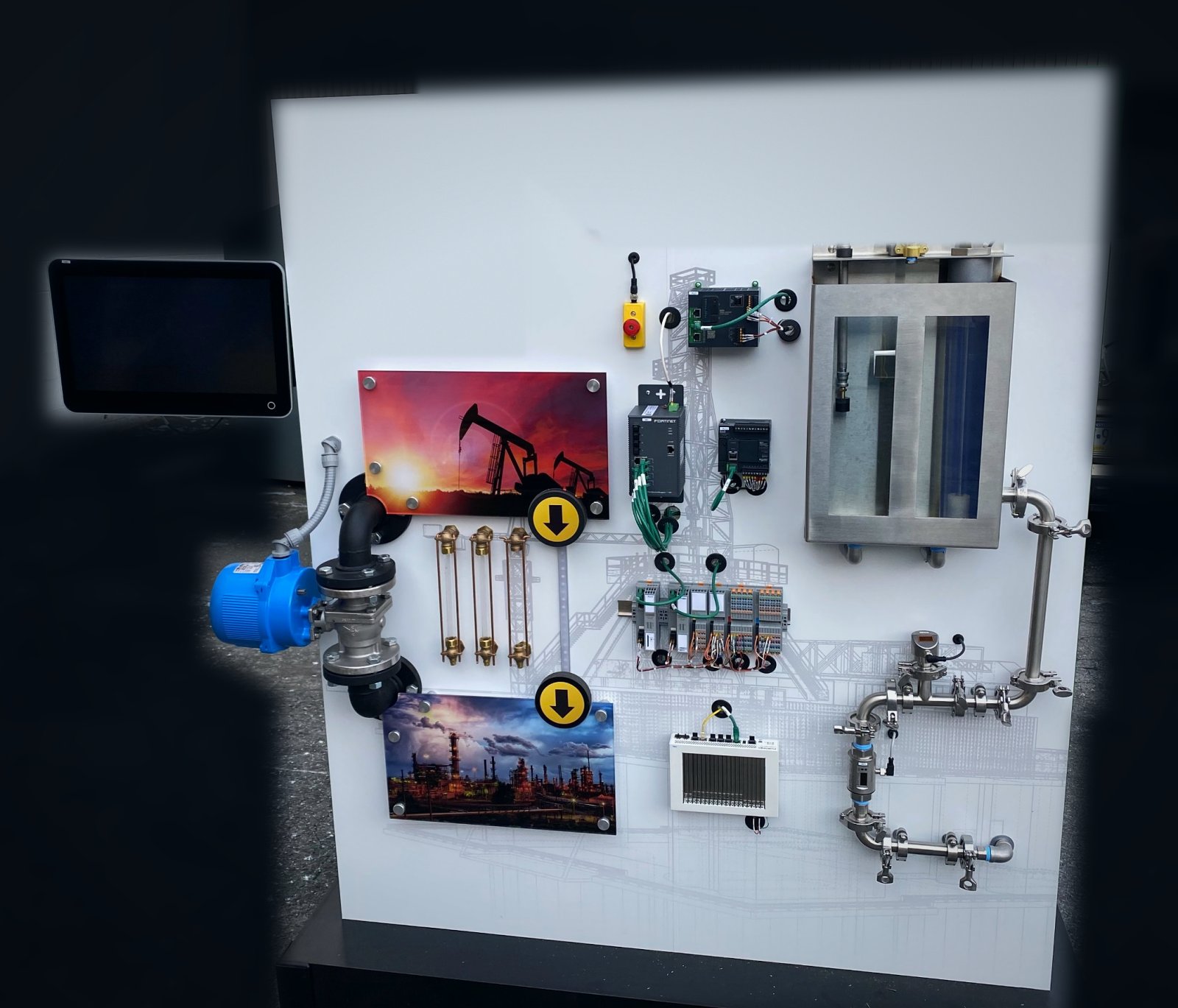 Wall panel trainer with pumps, valves, flow meters, PLCs, and process piping